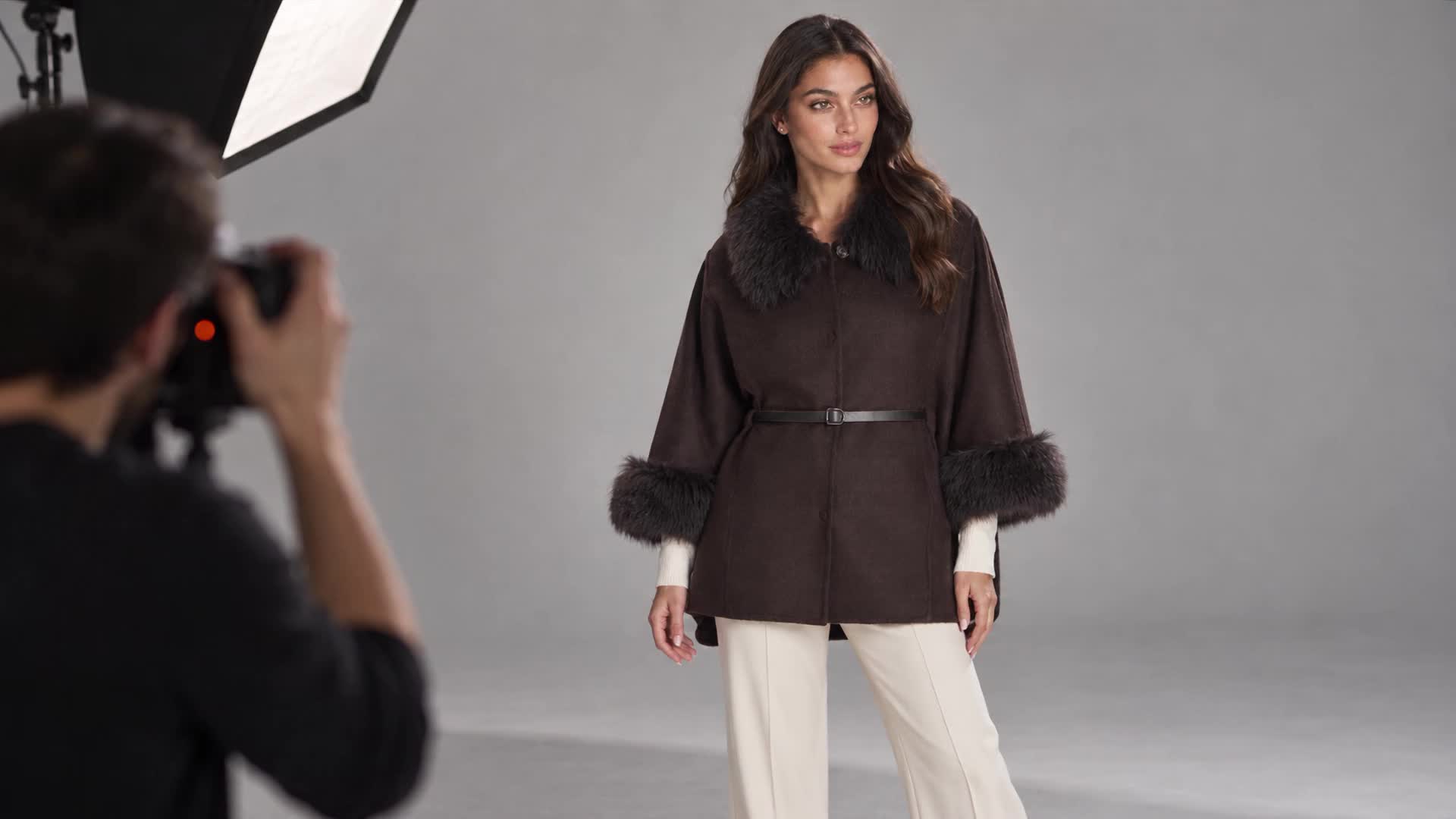 AI-created editorial studio scene featuring Maximilian Woolblend Cape with Fur trim Cuffs-Maximilian