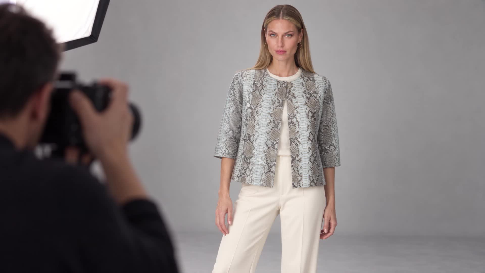 AI-created editorial studio scene featuring Maximilian 24-inch Python Jacket