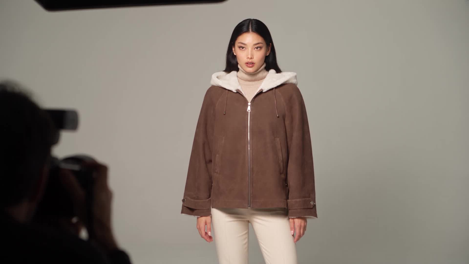 AI-created editorial studio scene featuring Maximilian Hooded Shearling Jacket-Maximilian